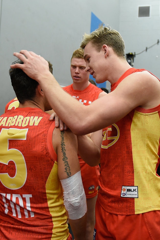 AFL 2016 Rd 16 - Gold Coast v Brisbane GOLD COAST, AUSTRALIA - JULY 09: Tom Lynch of the Suns celebrates with team mate Jarrod Harbrow during the 2016 AFL Round 16 match between the Gold Coast Suns and the Brisbane Lions at Metricon Stadium on July 9, 2016 in Gold Coast, Australia. (Photo by Matt Roberts/AFL Media)
